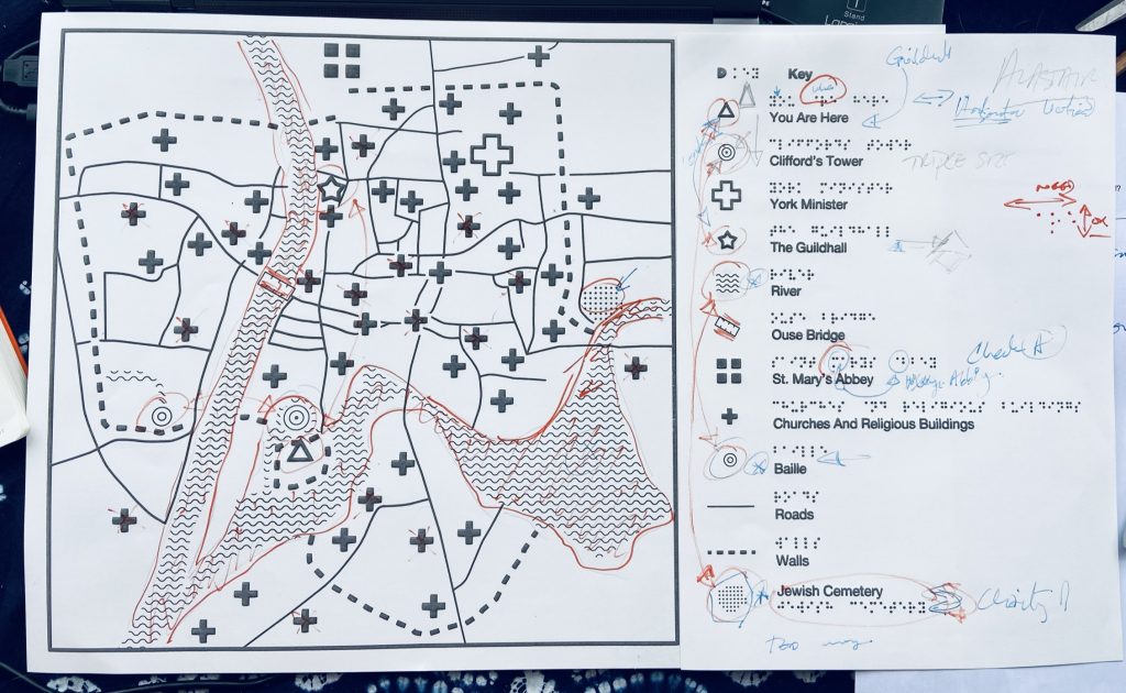 Tactile map of York with map of textures and symbols next to explanatory key in visual and Braille text