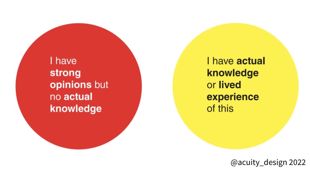 Two round stickers - red one has text “I have strong opinions but no actual knowledge” yellow one has text “I have actual knowledge or lived experience of this”