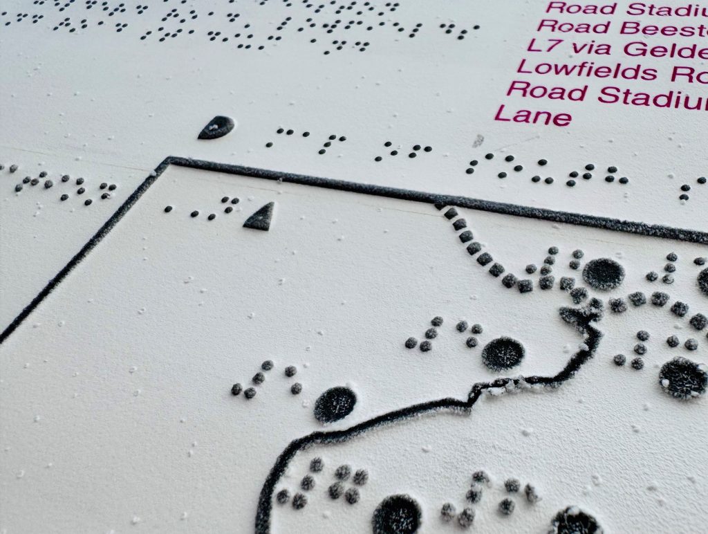 Close up of tactile map made for Leed tram route consultation with symbols and Braille