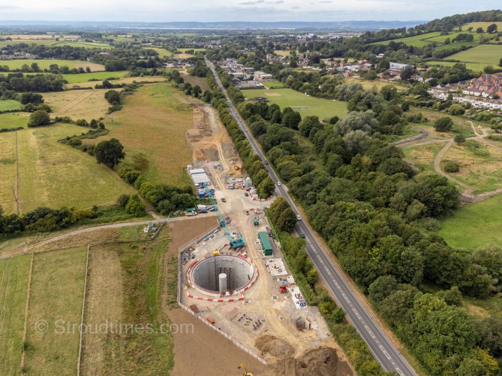 Drone view of field outside Stroud with huge circular concrete hole in it - about 4 to 6 road lanes wide