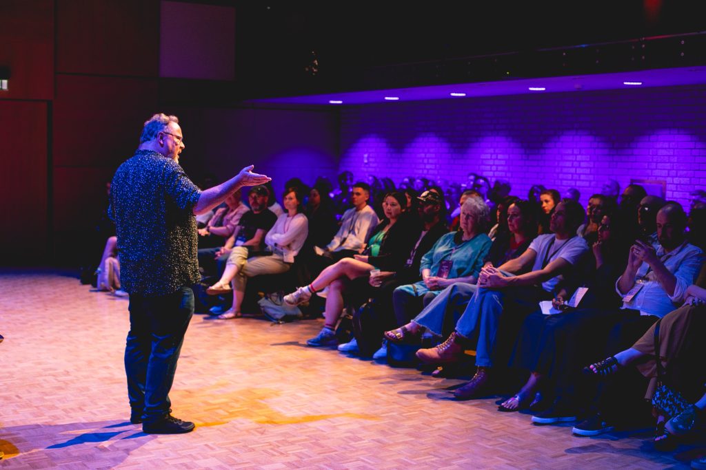 Alastair gesturing towards audience at CampDigital